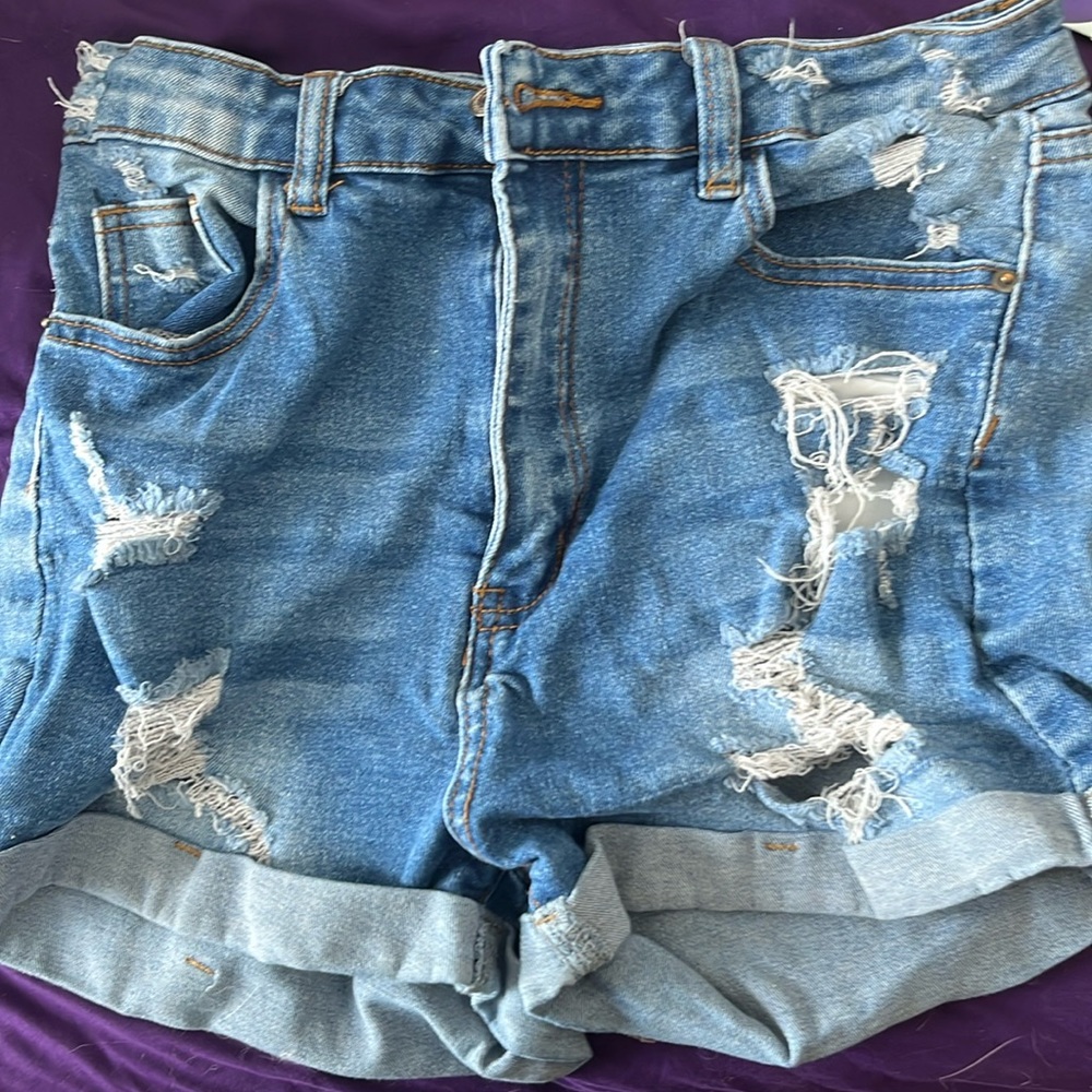 I am selling Jean shorts the button is broken sorta